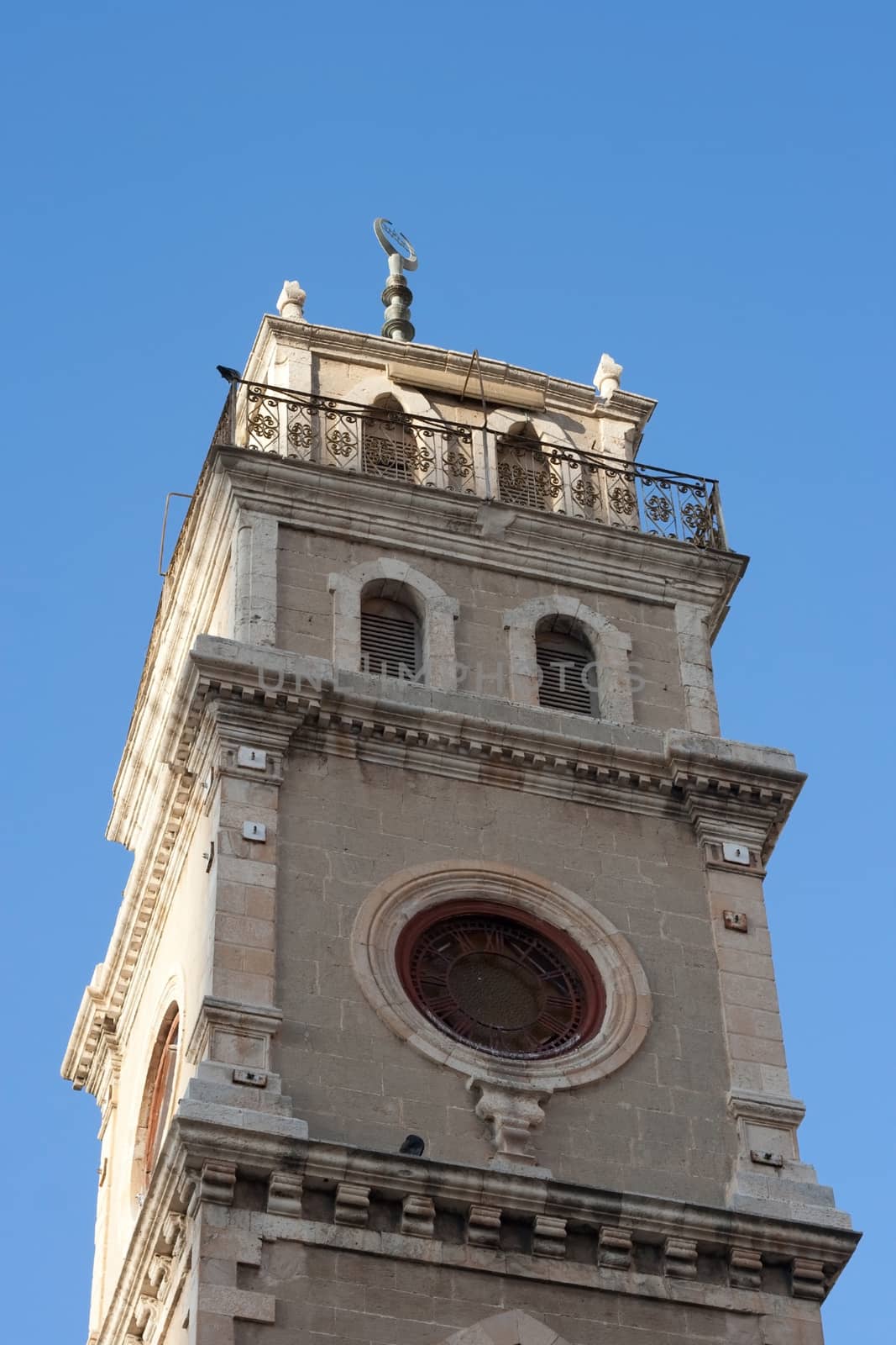 old musque tower with blue sky and sunlight