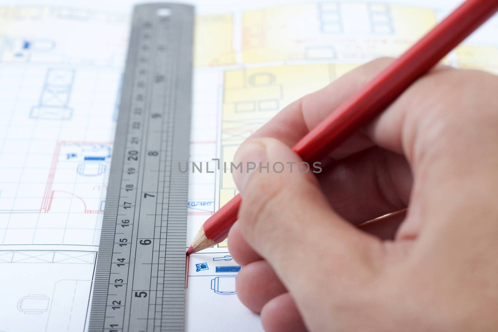 drawing a house plan with pencil and ruler