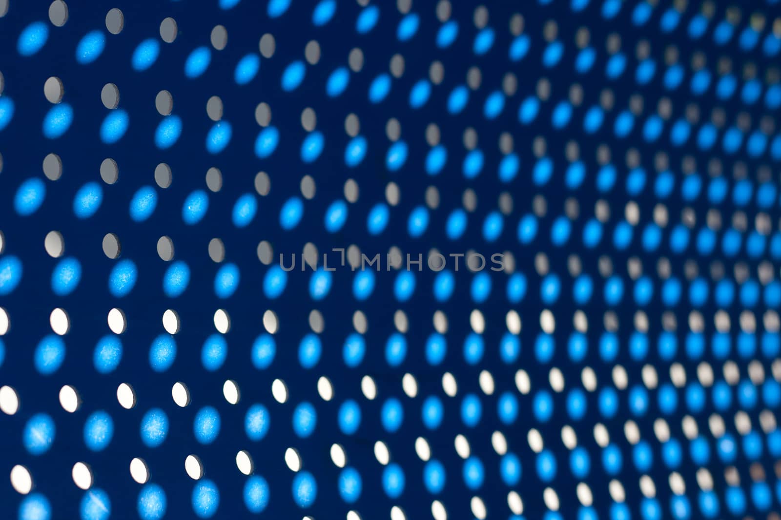 blue background with holes and light dots