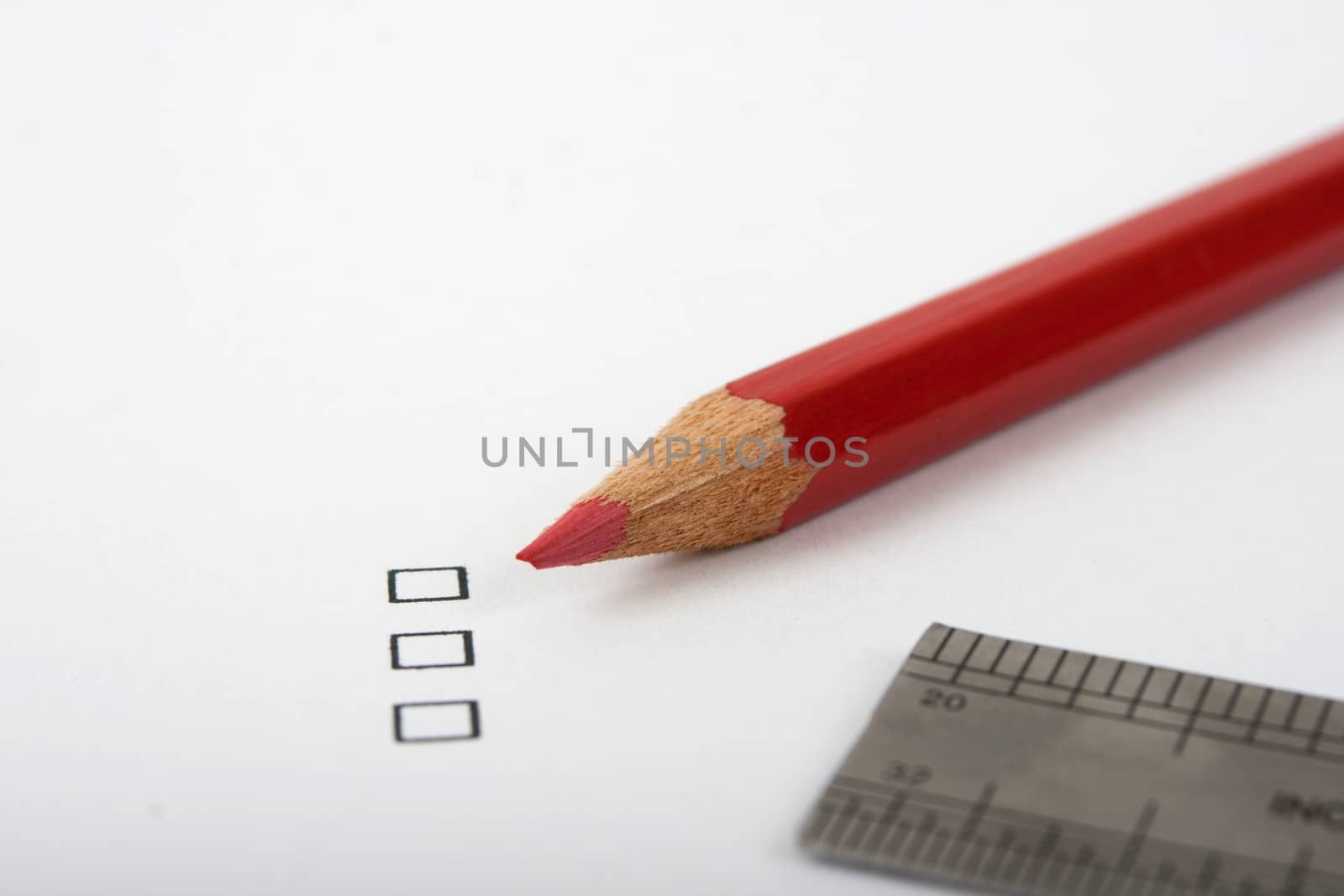 black checkbox white page  red pencil and metal ruler
