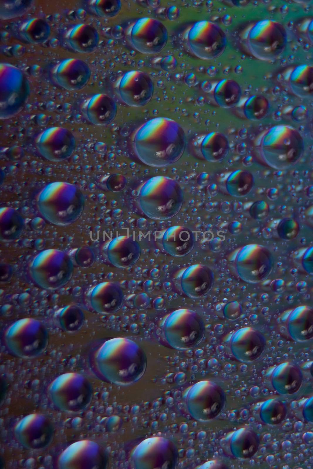 abstract colored watter drops closeup on cd 