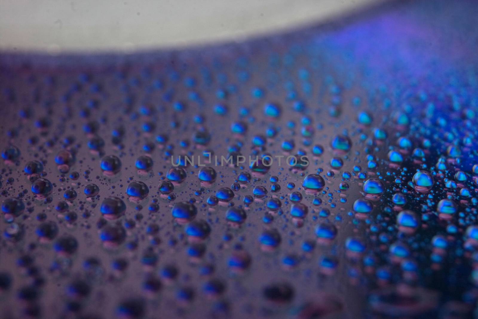 abstract colored watter drops closeup on cd