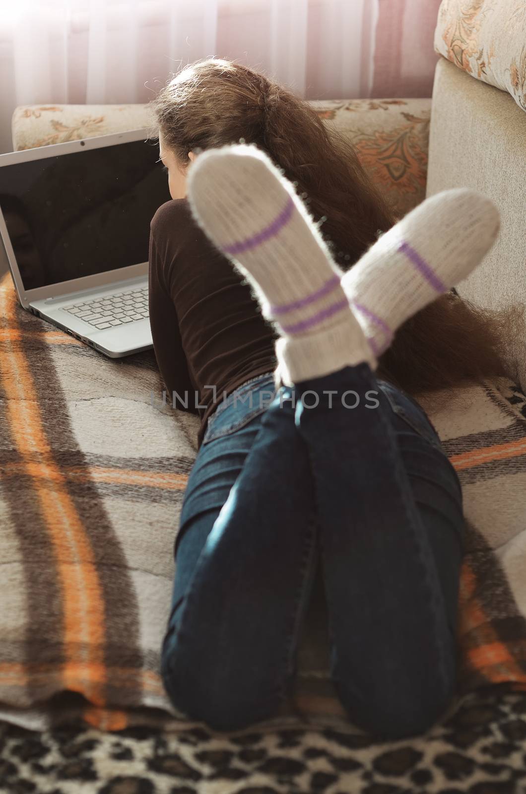 Young Cute Female Student Doing Homework in Bed. College Student Doing Homework in Bed at Home, Young Woman Preparing School Test in Bedroom. Education Concept.