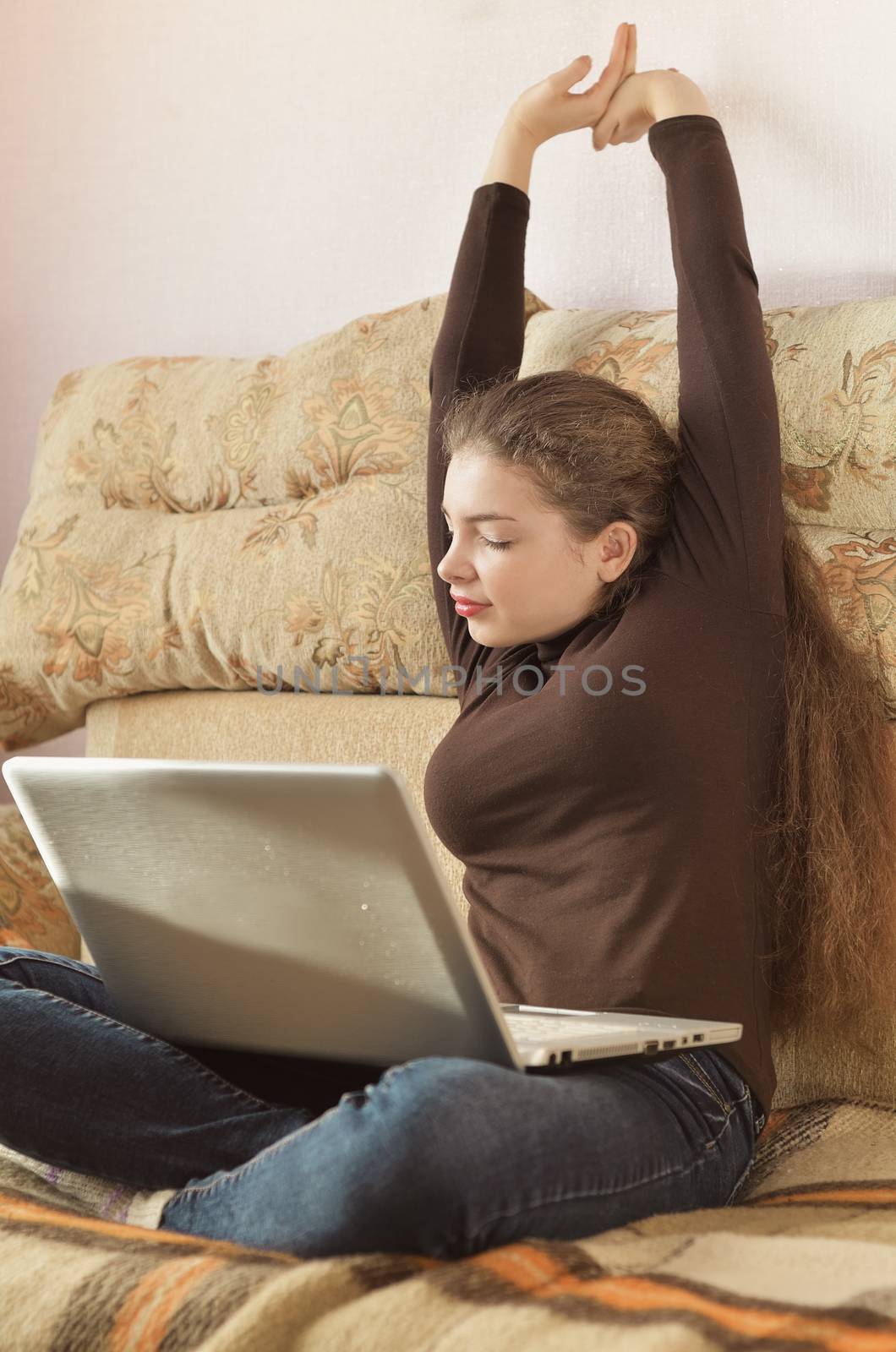 Young Cute Female Student Doing Homework in Bed. College Student Doing Homework in Bed at Home, Young Woman Preparing School Test in Bedroom. Education Concept.