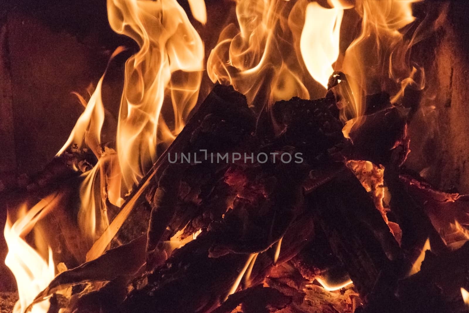 Fire flames, bonfire close up photo. Beautiful natural phenomen of dangerous burning wood.