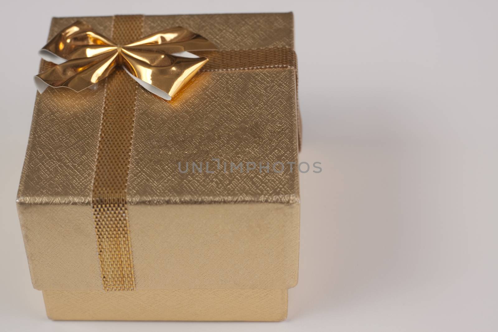 single closed cover golden ring box on white background