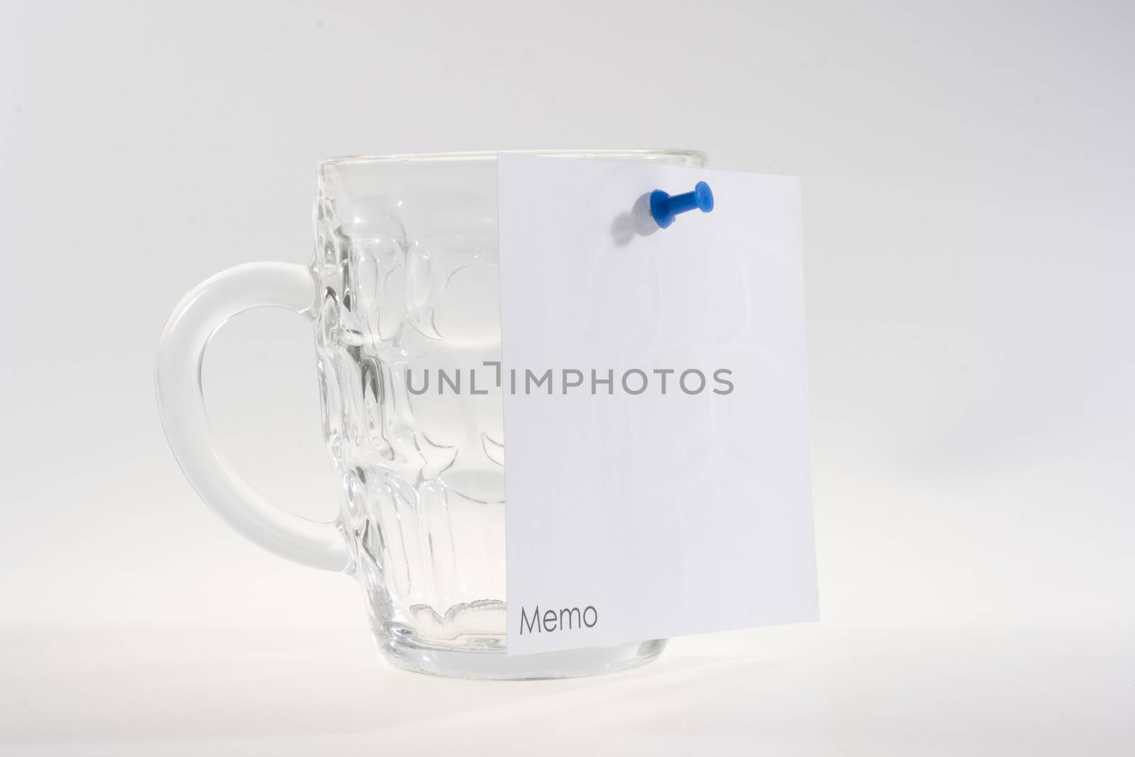 beer mug and a white memo note