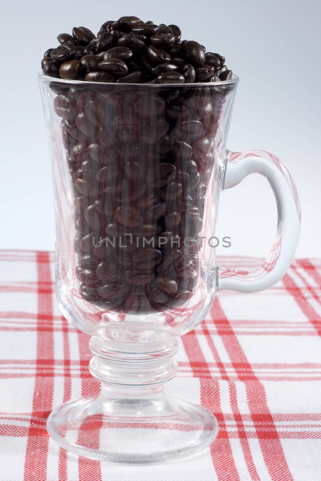 a cup full of coffee beans