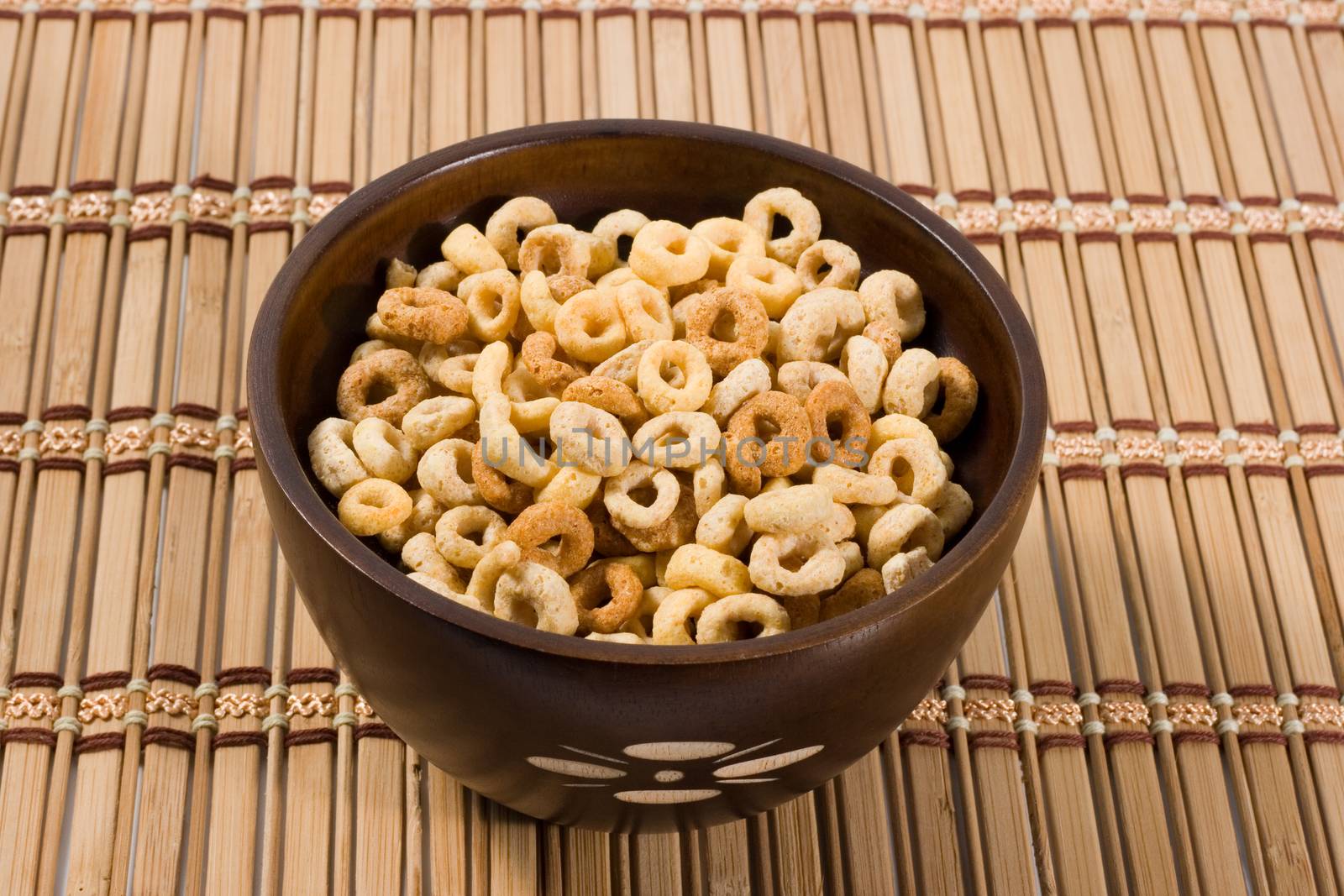 corn flakes in a wood bowl