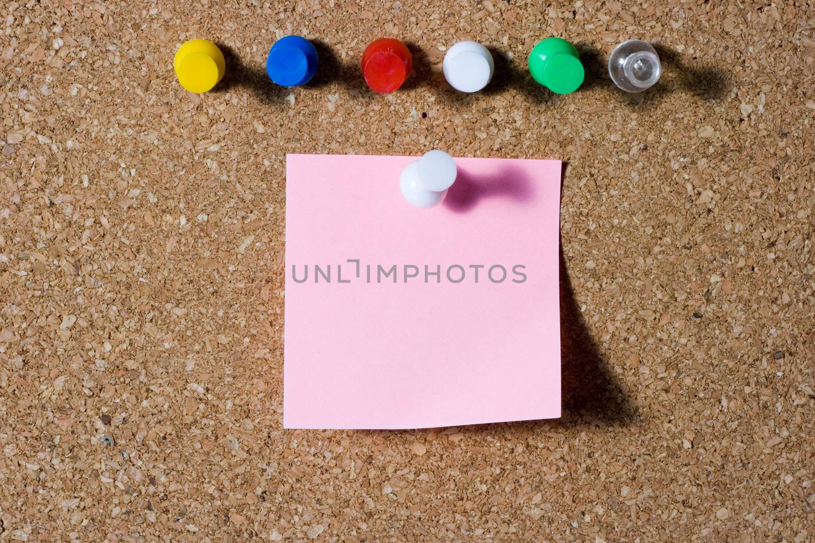 pink note with colored push pins