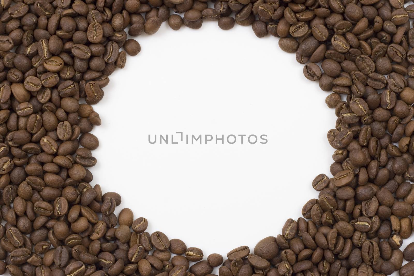 round frame made of coffee beans white in the midle