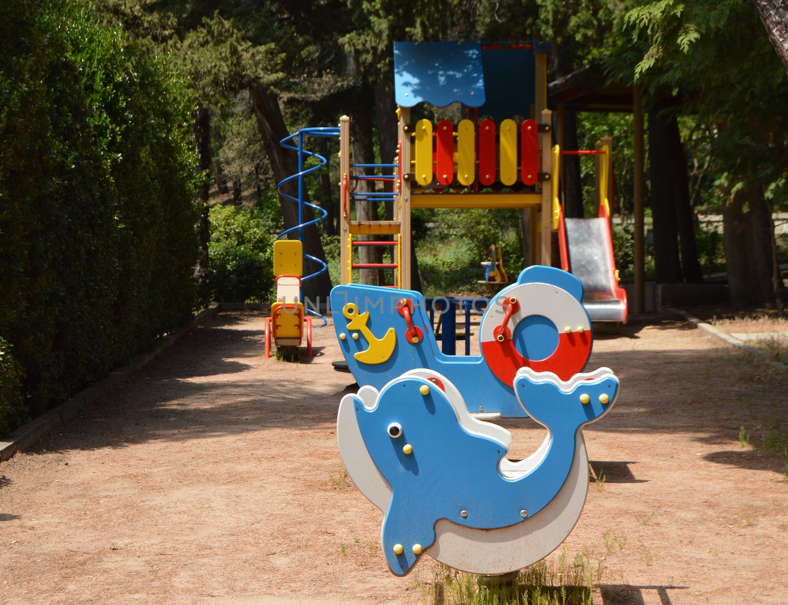 Colorful Playground in the yard in the Park on a Sunny summer day by claire_lucia