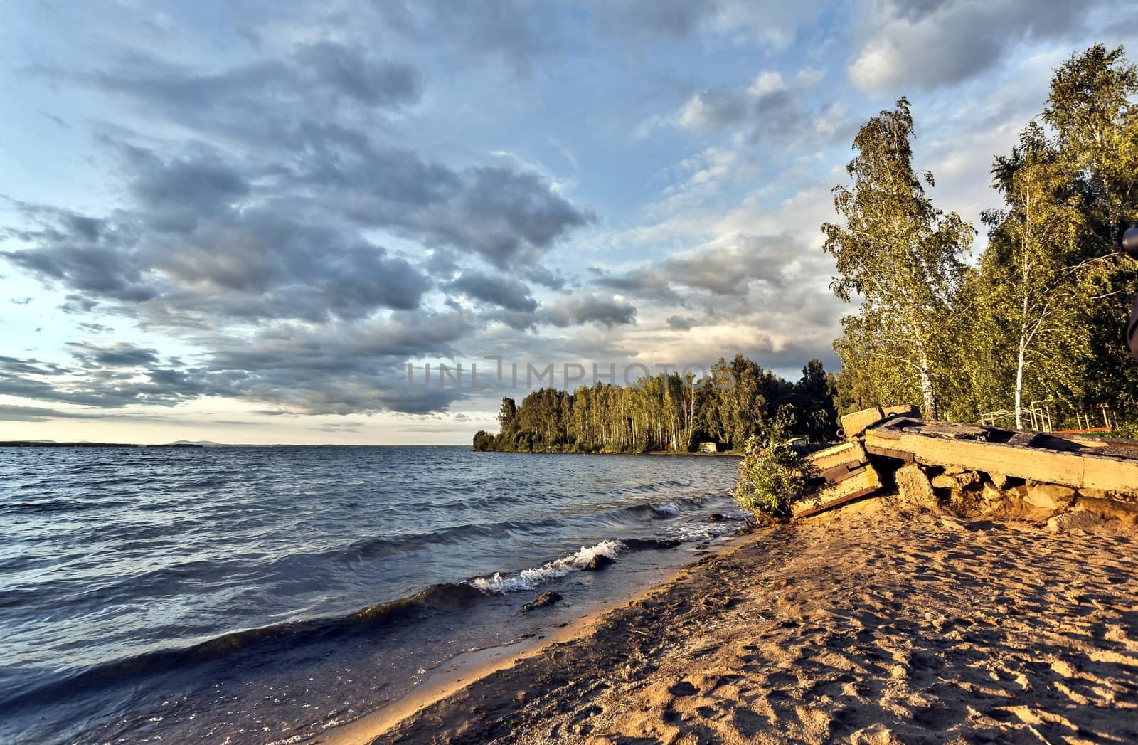 colorful evening cloudy sky over the lake, South Ural, Uvildy