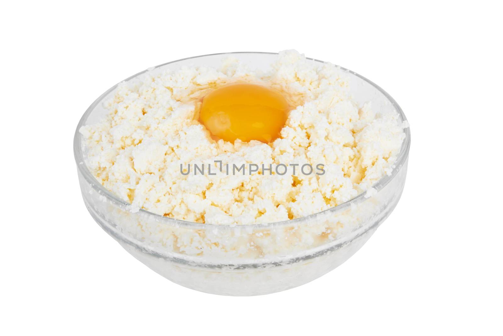 Cottage cheese with egg in glass bowl on a white background 