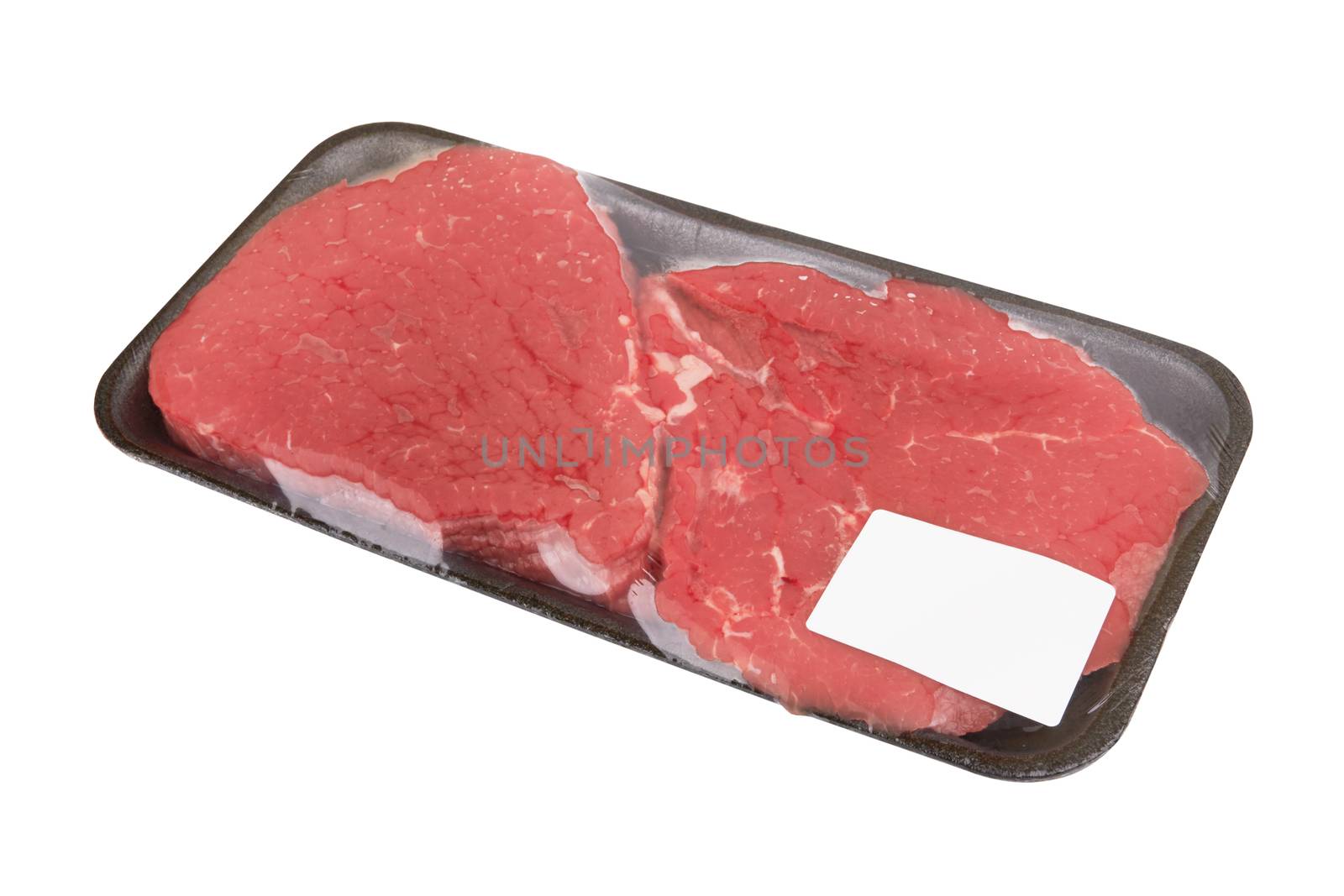 Fresh raw meat in package isolated on white background