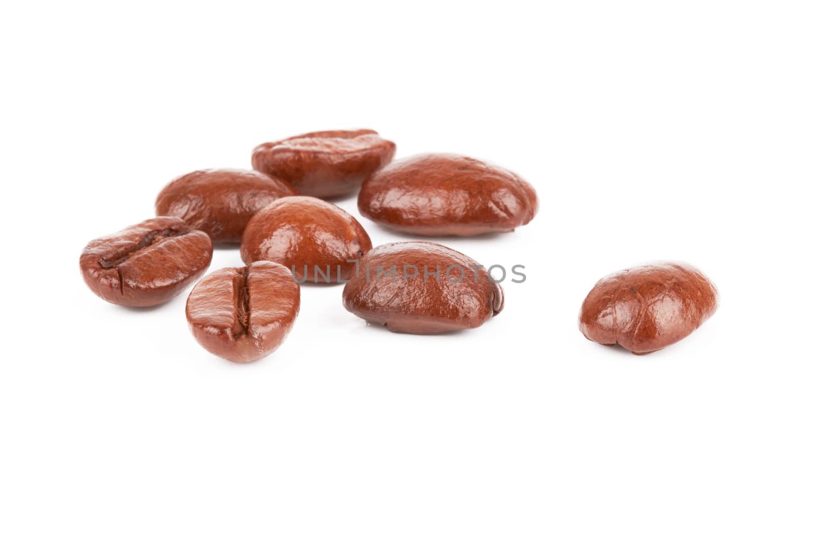 Brown coffee beans on a white background
