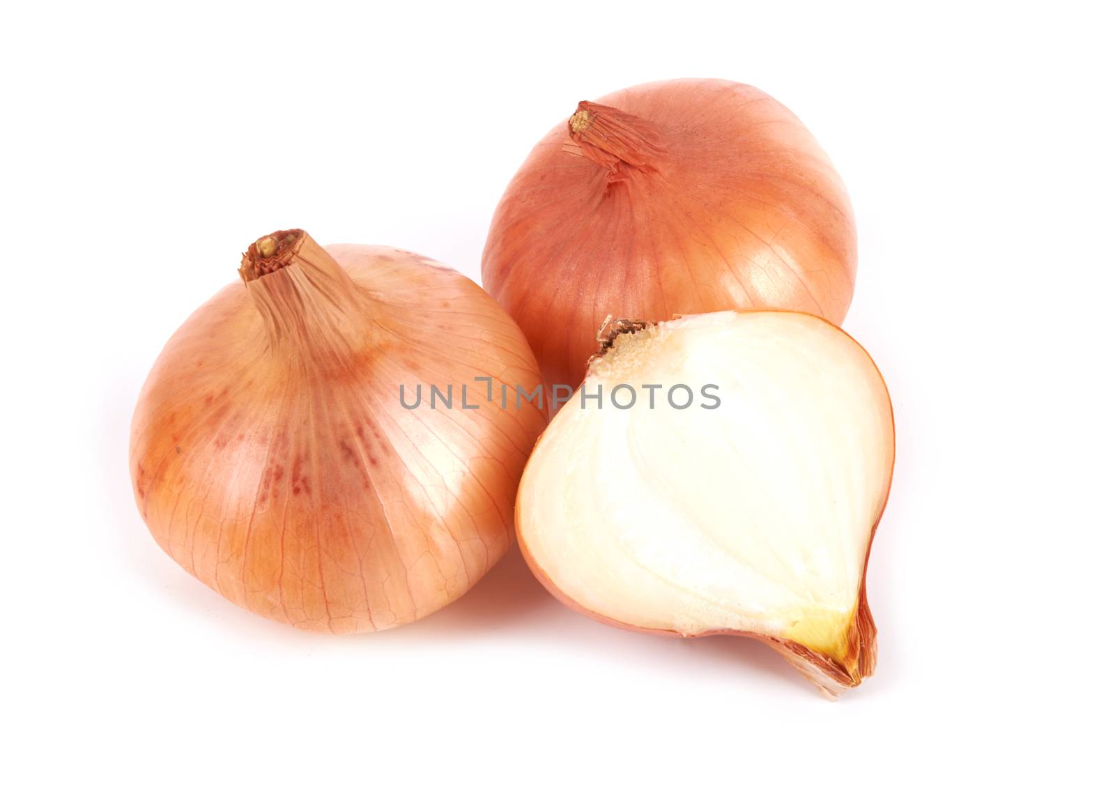 Gold onion bulbs isolated on white background