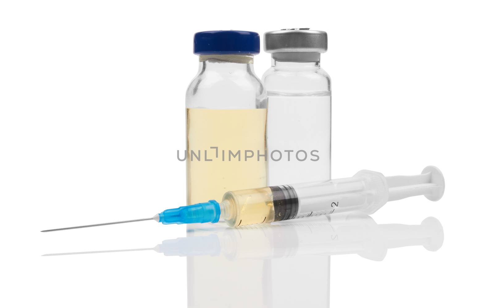 medical ampules and syringe on white 
