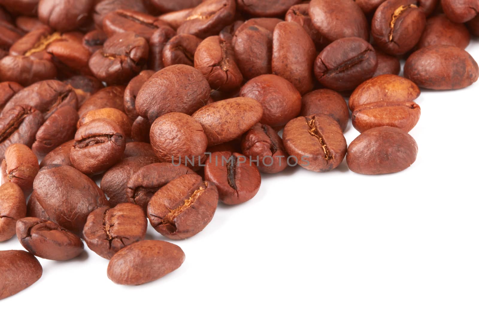 Brown coffee beans on a white background