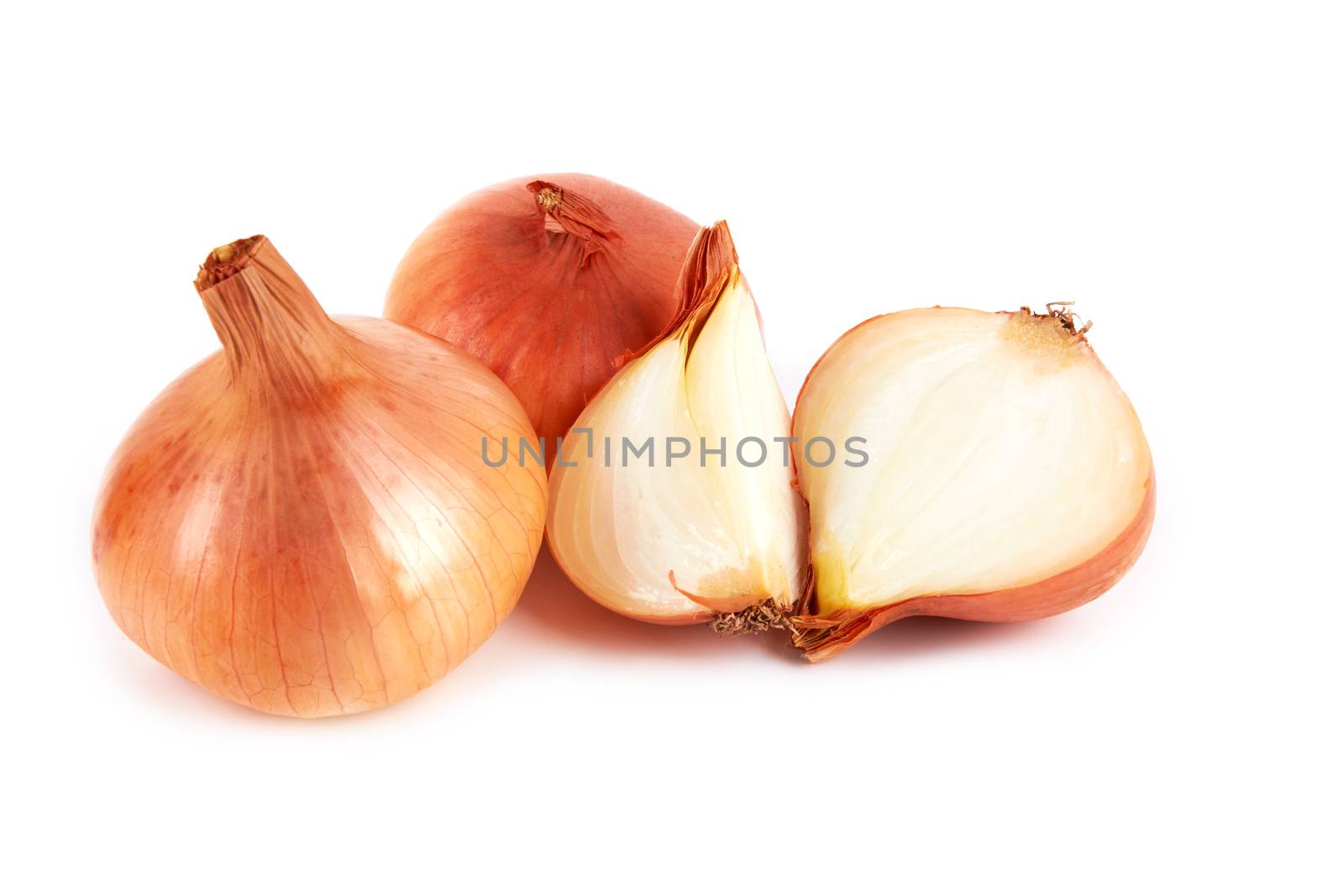 Gold onion bulbs isolated on white background