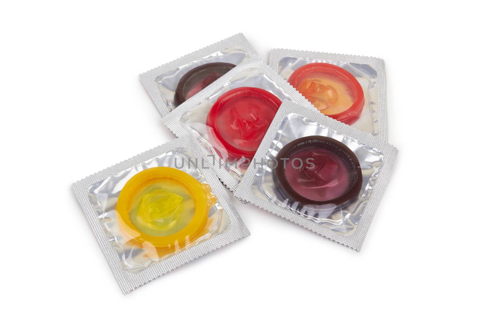 Colorful condoms isolated on white background