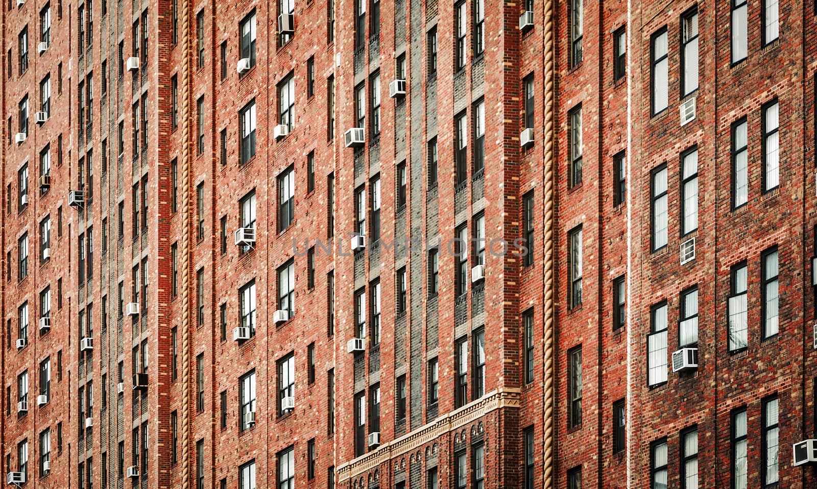 City building facade with pattern windows effect in row