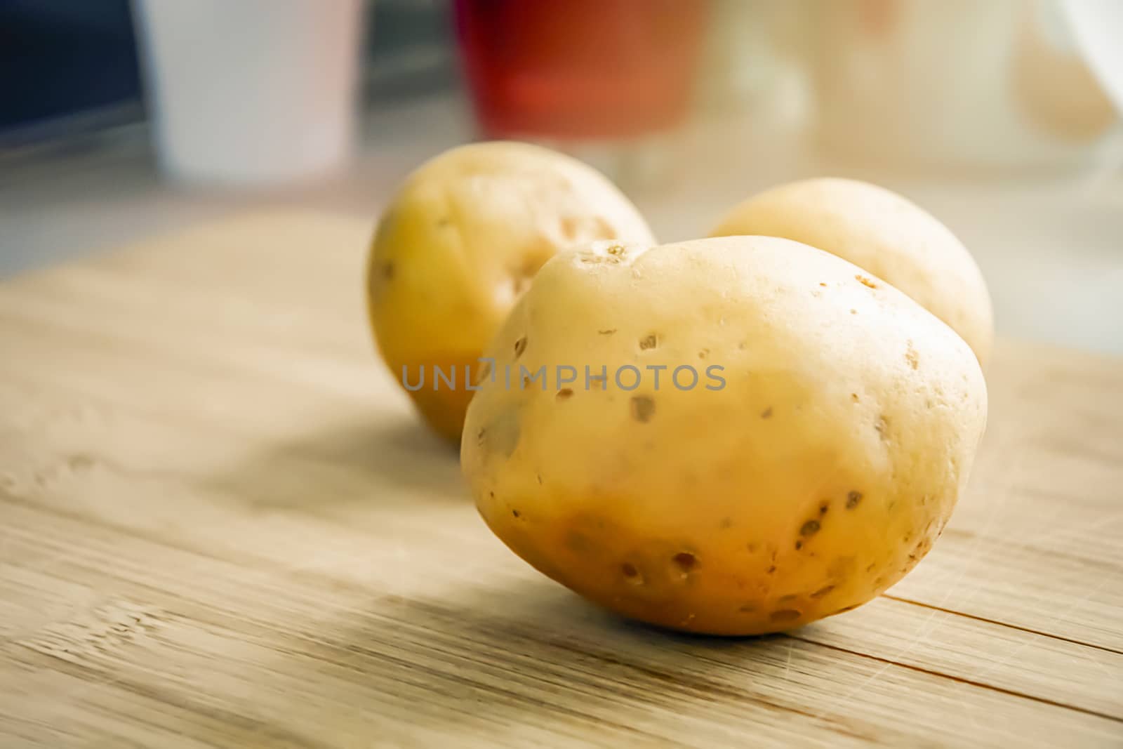 Still life of raw potatoes on a wooden table. Food and health concept. Carbohydrate