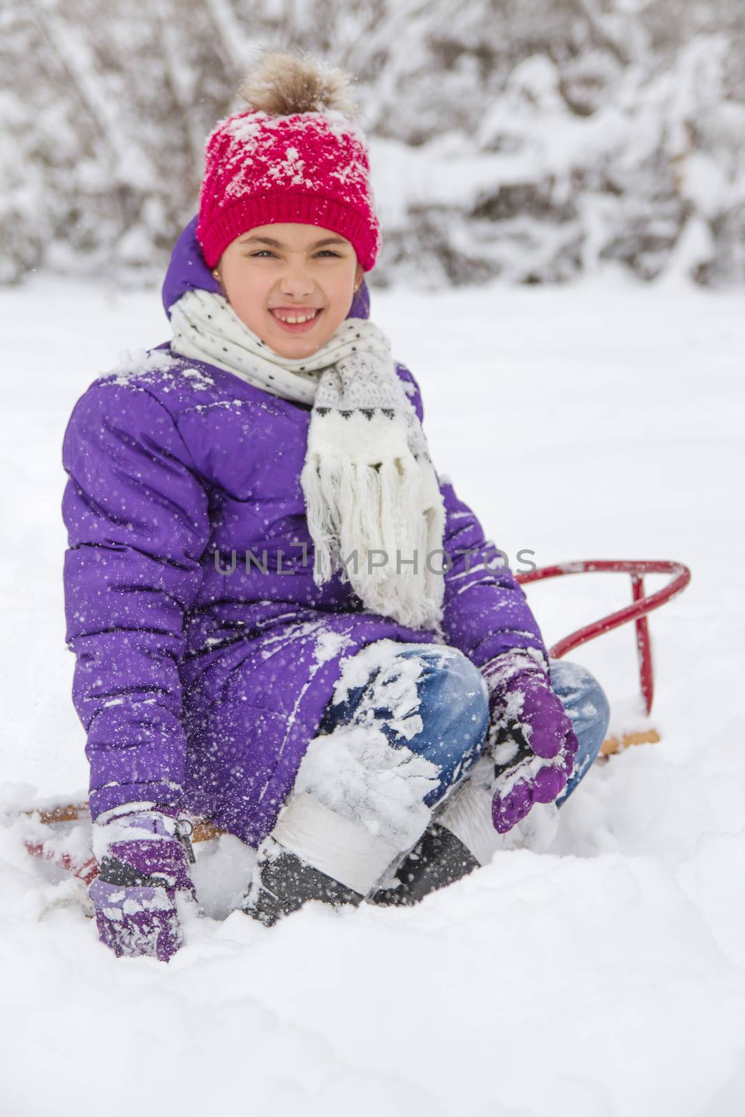Girl playing in snow in winter park by Angel_a