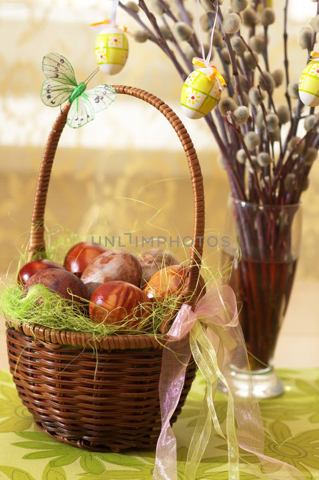 Easter eggs. Painted Easter eggs, assembled braided basket, along with pussy-willow, which are inserted into vase.