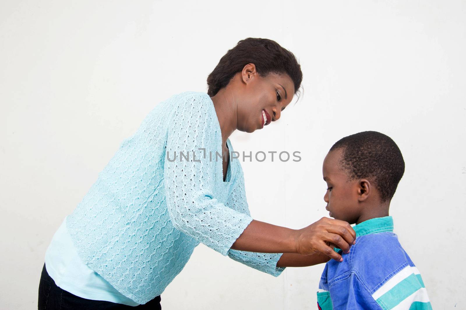 smiling mother cares for her son.