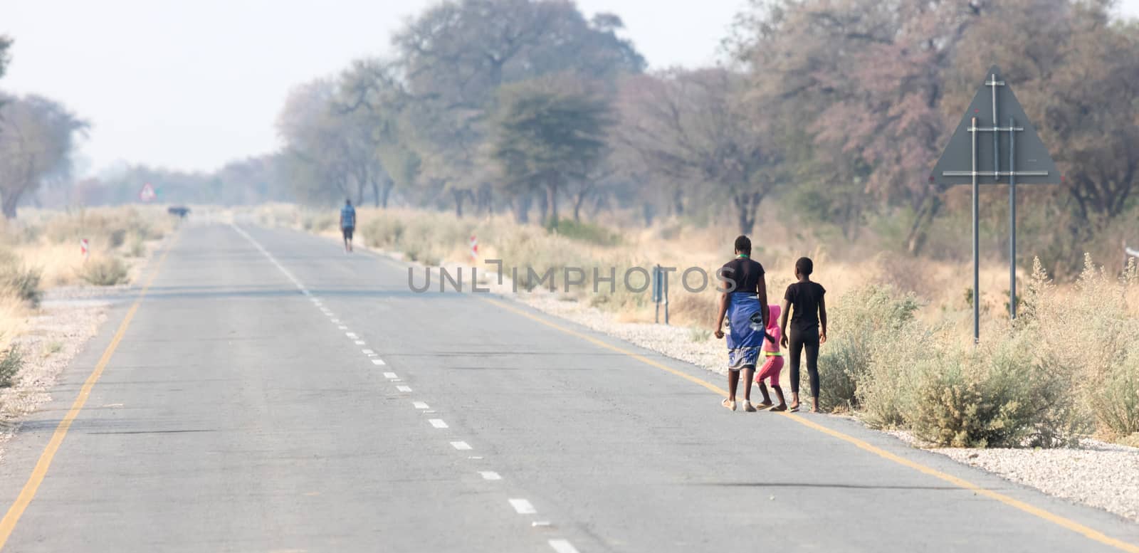 People walking at the side of the road, Namibia