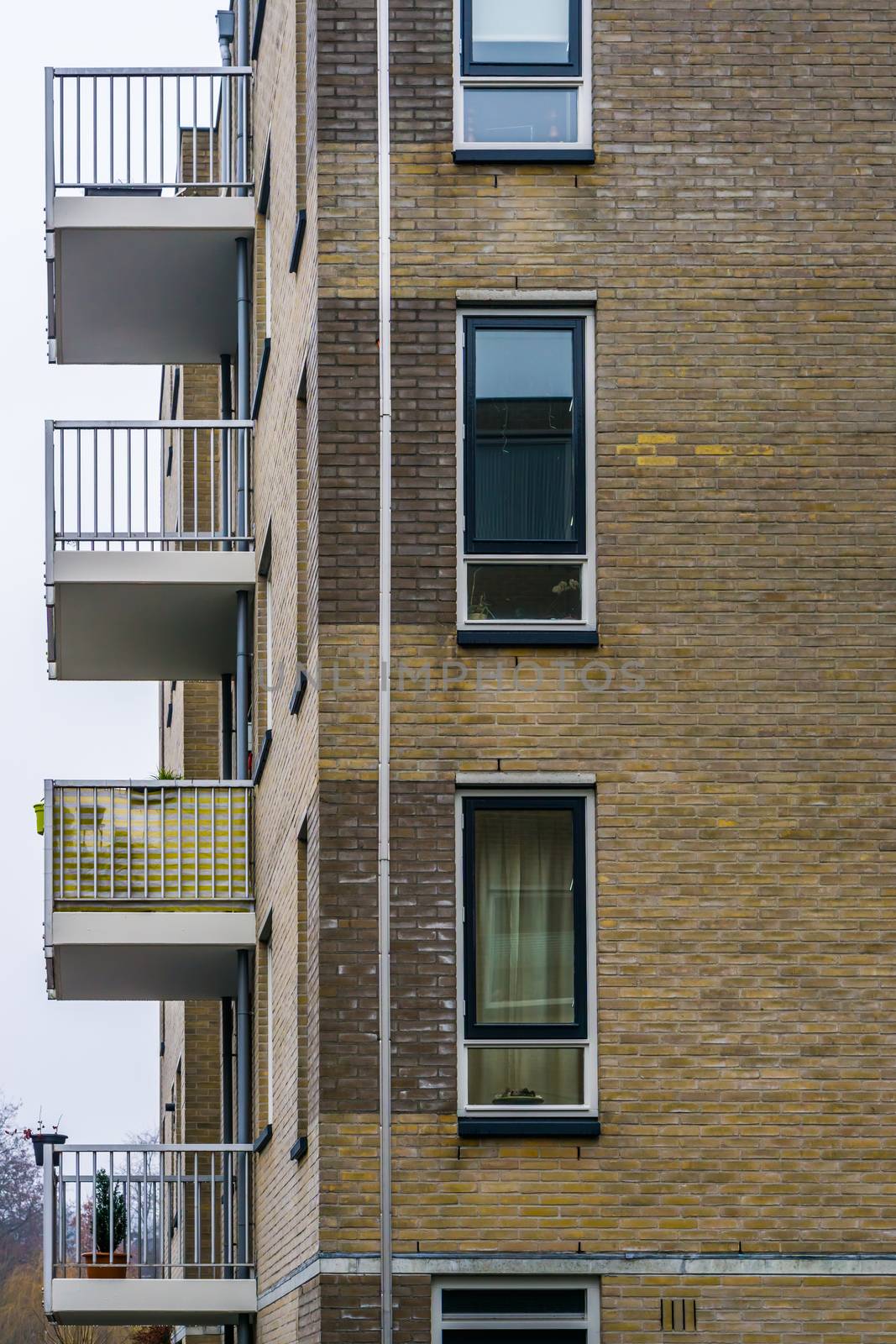 Modern dutch city architecture, apartments complex with balcony's and windows by charlottebleijenberg