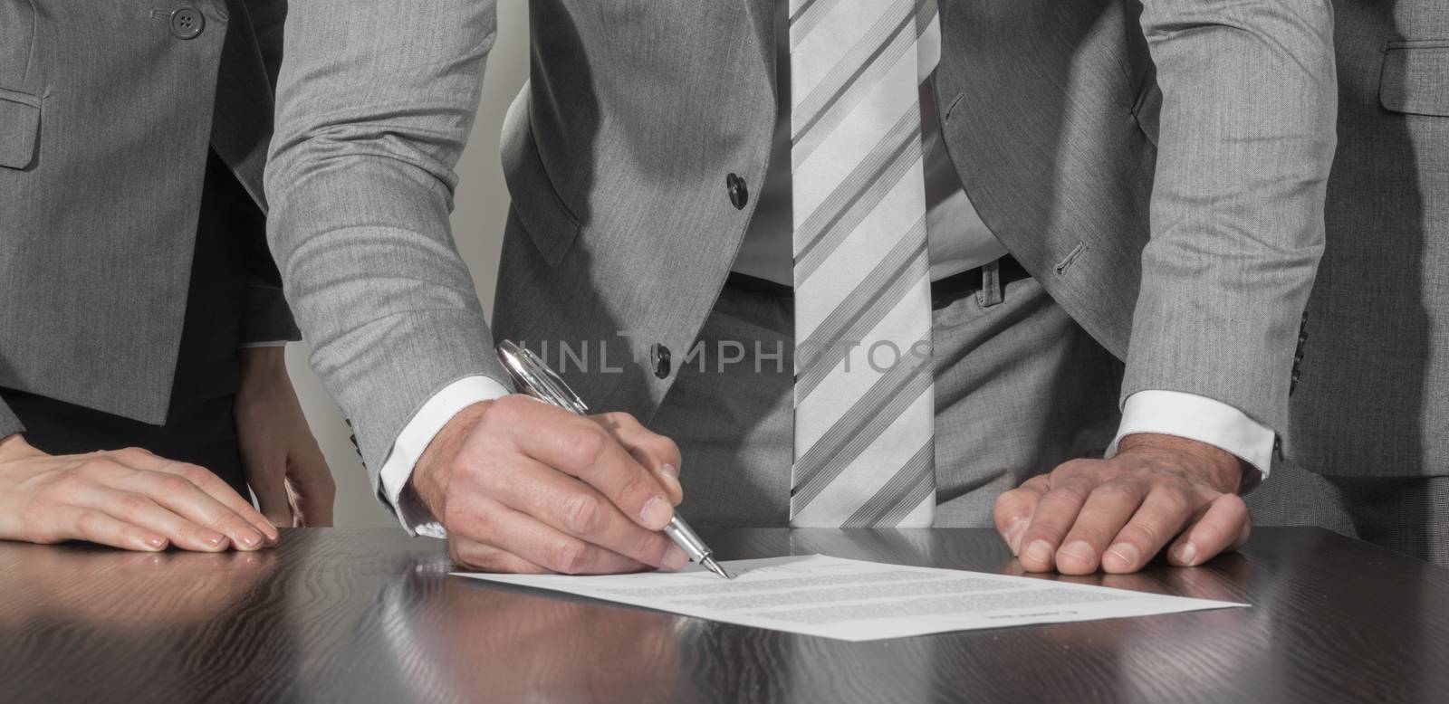 Business people sign up contract by Yellowj