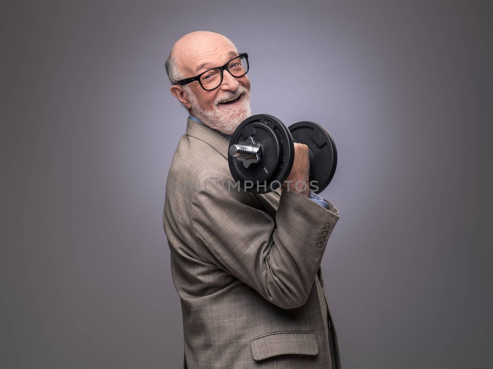 Senior man with dumbbell by ALotOfPeople