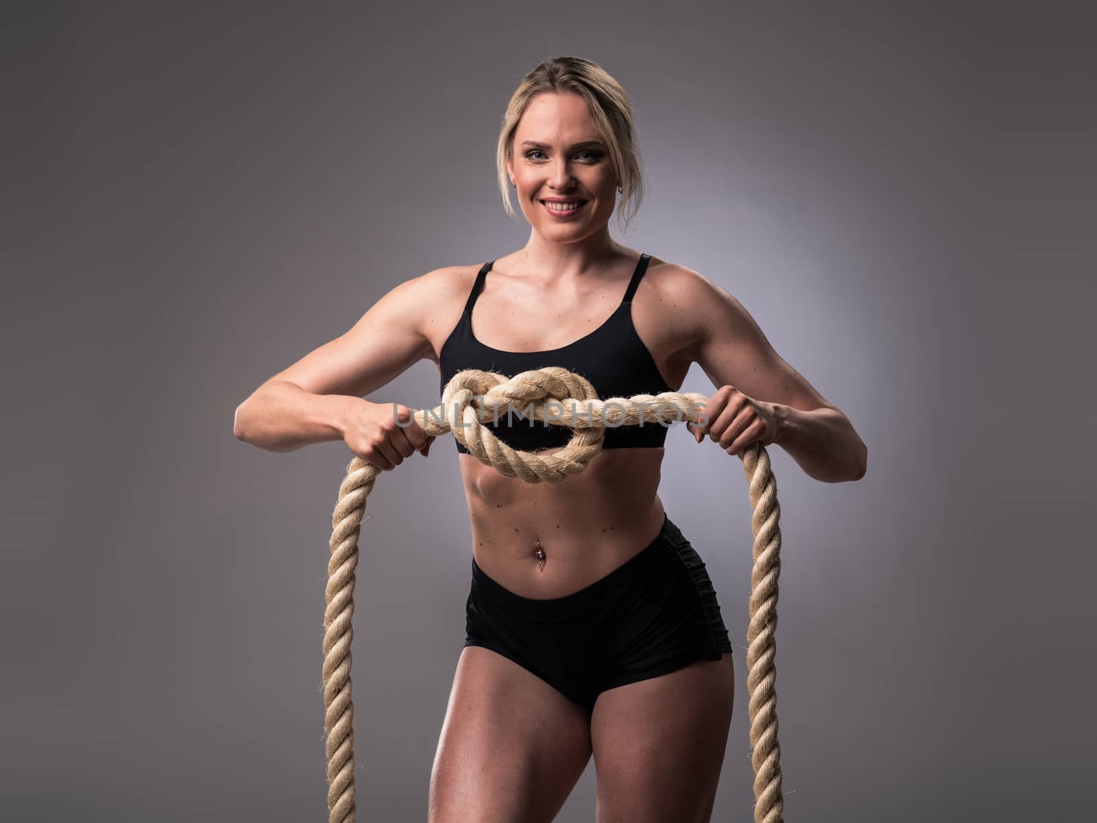 Muscular woman with heavy ropes by ALotOfPeople