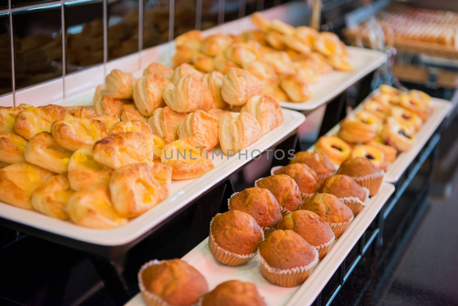 fresh bread and cake lying on the shelf