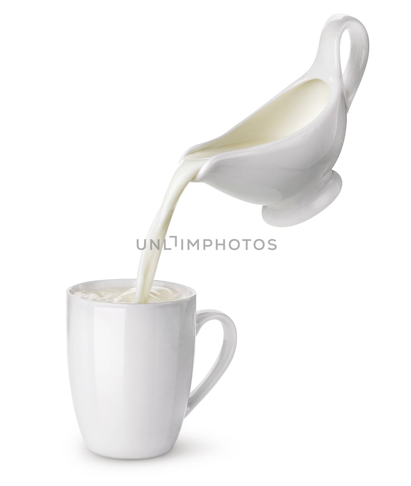 Pouring cream from creamer into ceramic cup with splash isolated on white background, flowing milk