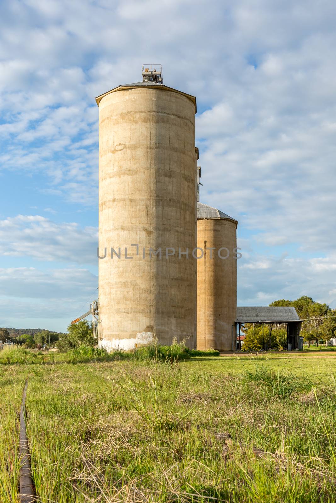 Old grain silos and a disused rail line after the government did not repair the rail line after flooding