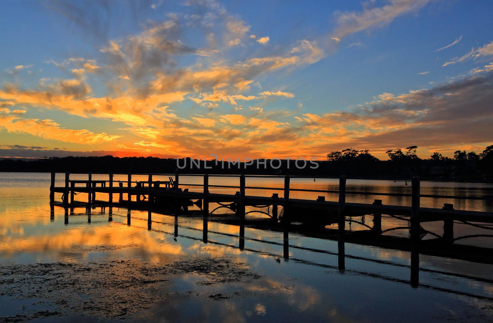 Beautiful sunset and timber jetty silhouette by lovleah