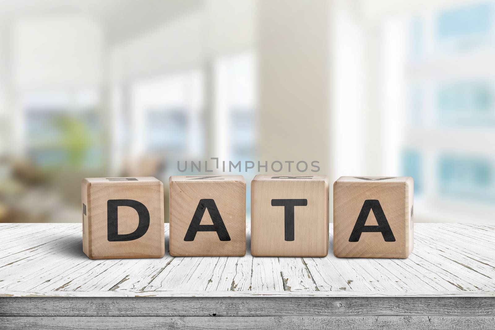 Data sign on a table with white planks in a bright room in daylight