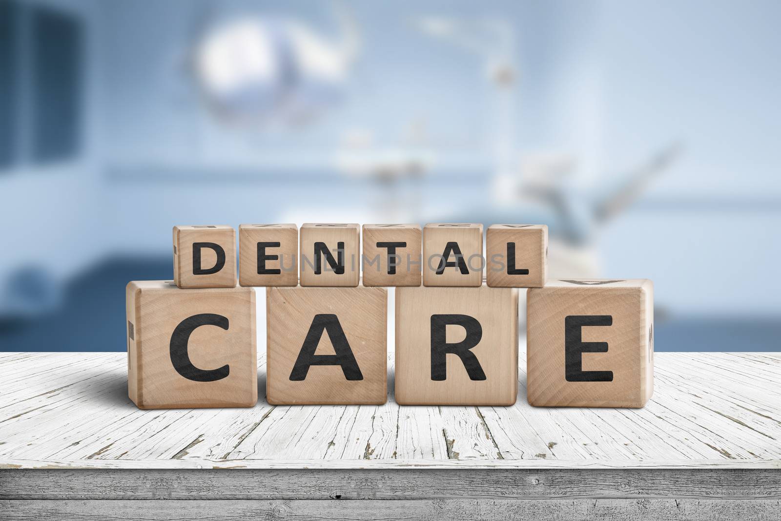 Dental care sign on a table at a dentist with a blurry blue room in the background