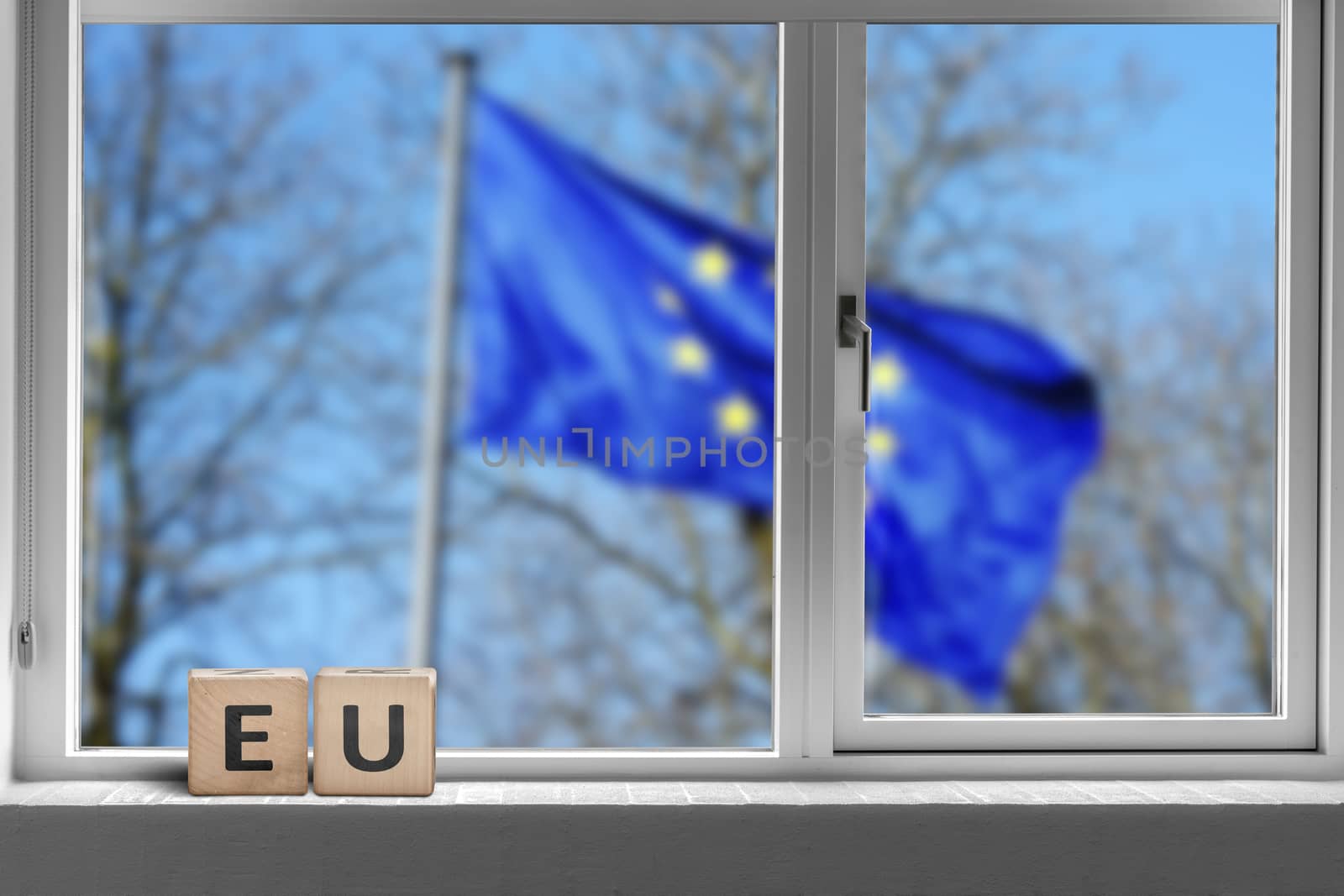 EU sign in a window with the European union flag by Sportactive