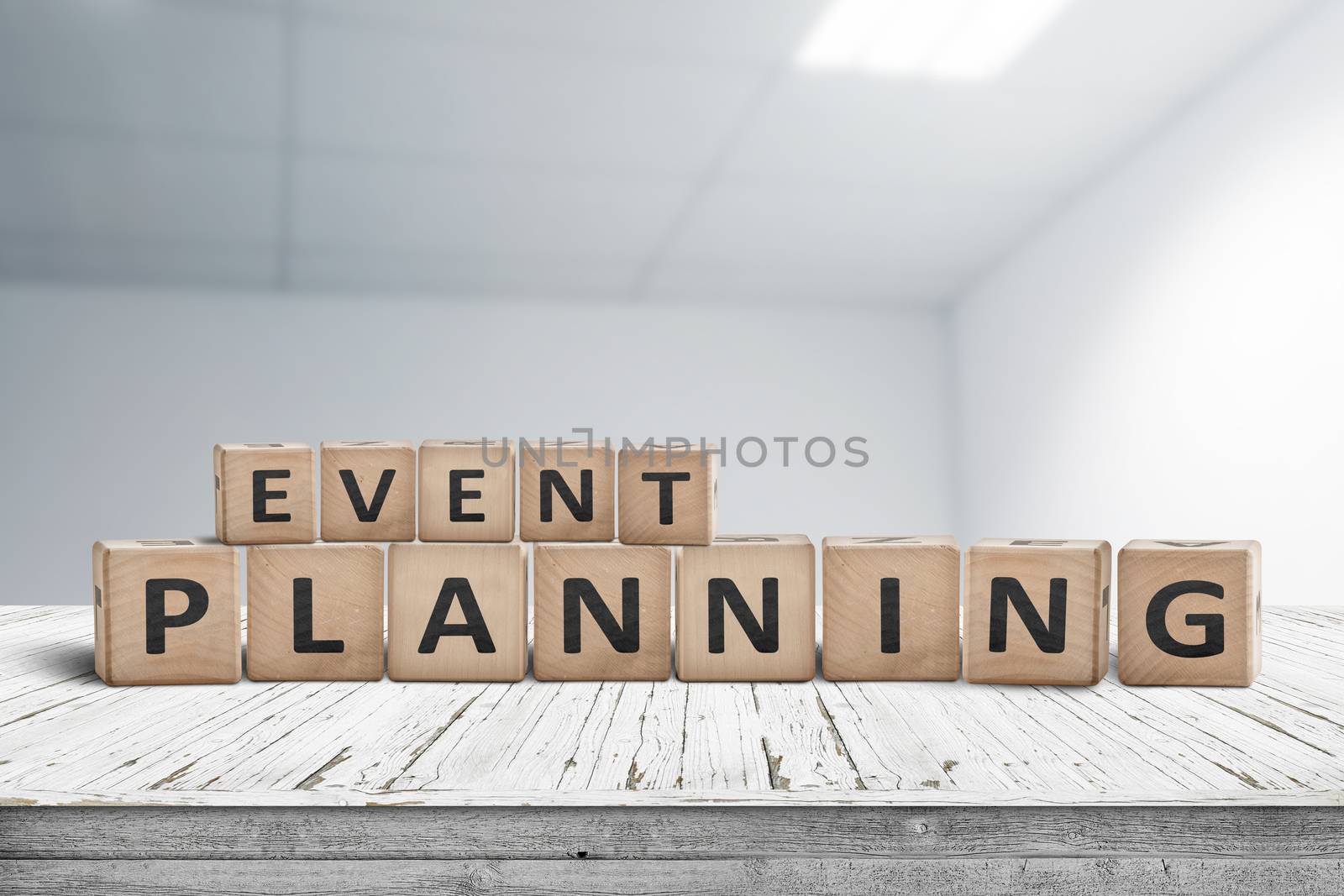 Event planning sign on a wooden desk in an office with a blurry grey background
