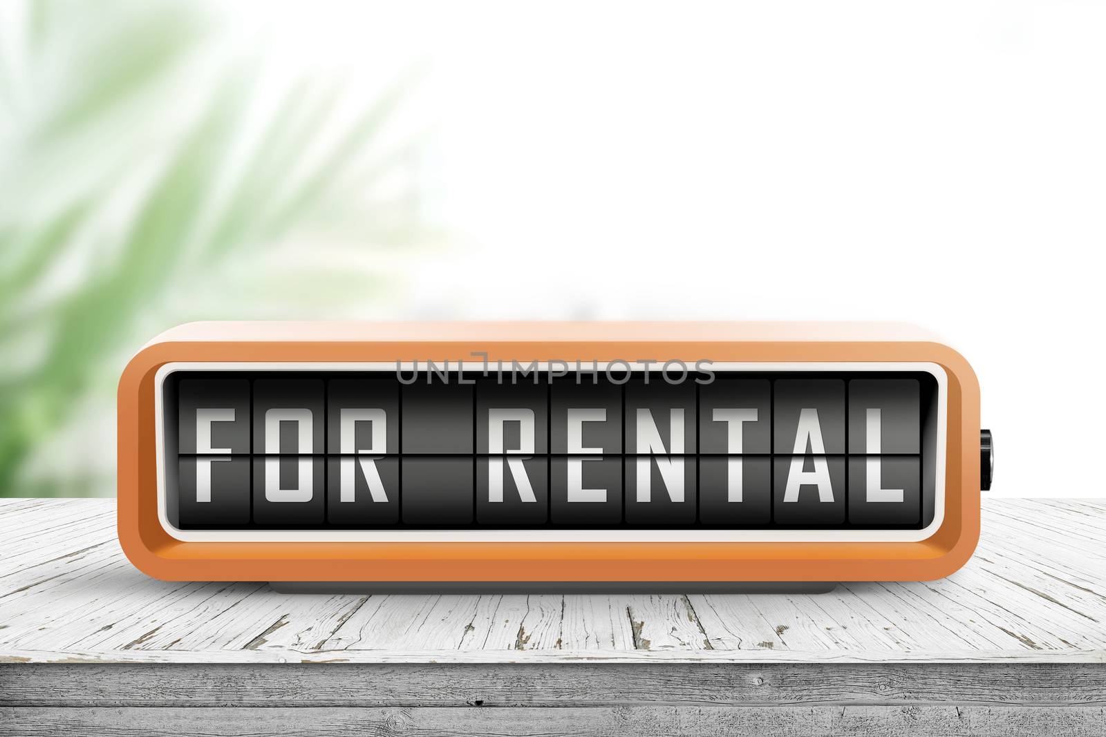 For rental text on an analog device in orange color in a bright room with a tropical plant