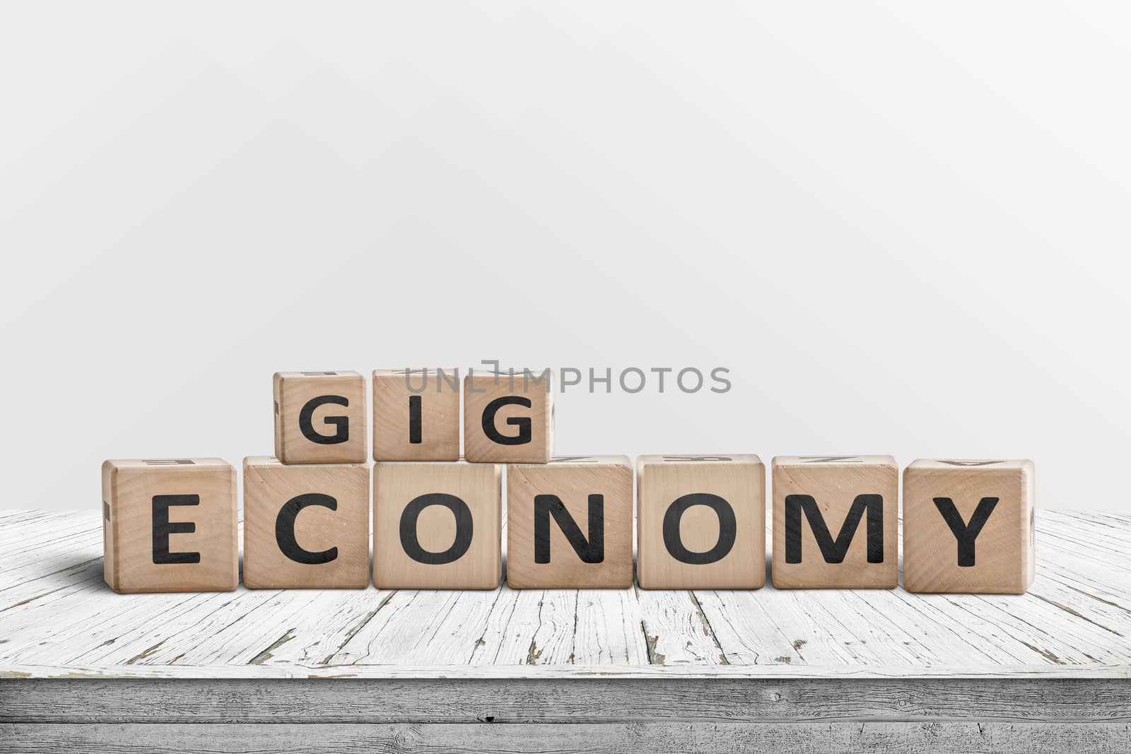 Gig economy sign made of wood on a worn table by Sportactive