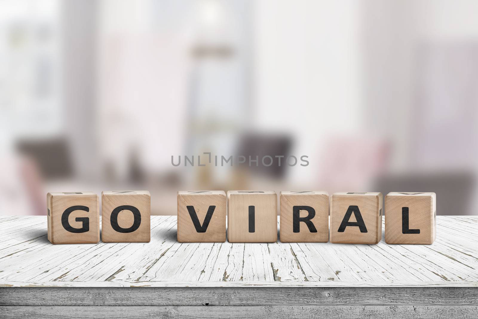 Go viral message sign on a wooden table by Sportactive