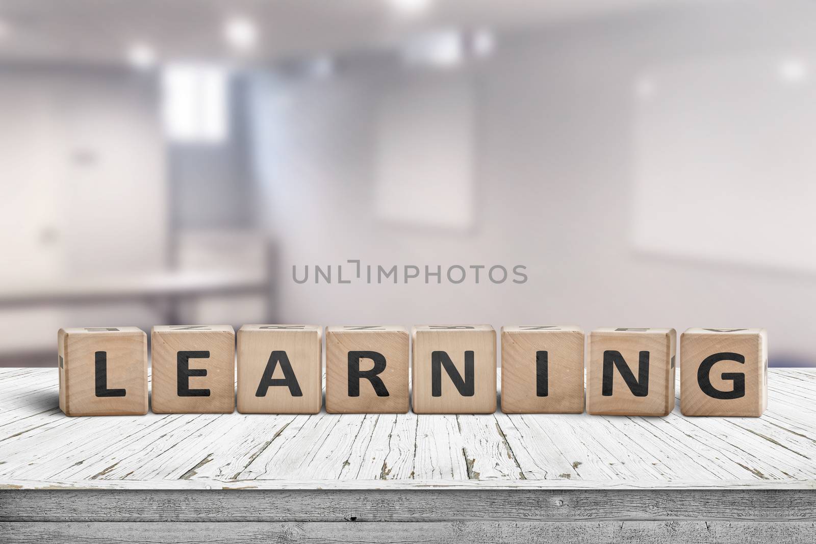 Learning in a classroom with a sign on a wooden table in a bright room