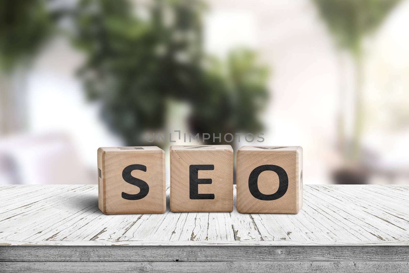 SEO word sign on a table in a bright room by Sportactive