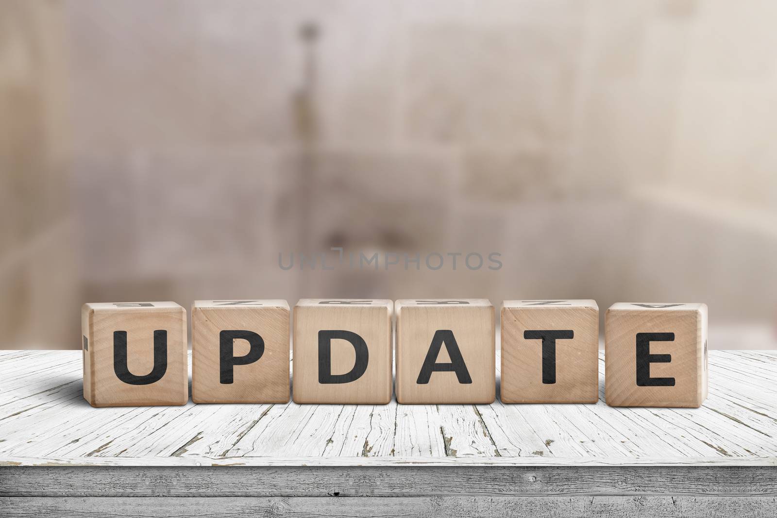 Update message sign on a wooden desk in a room with a blurry background