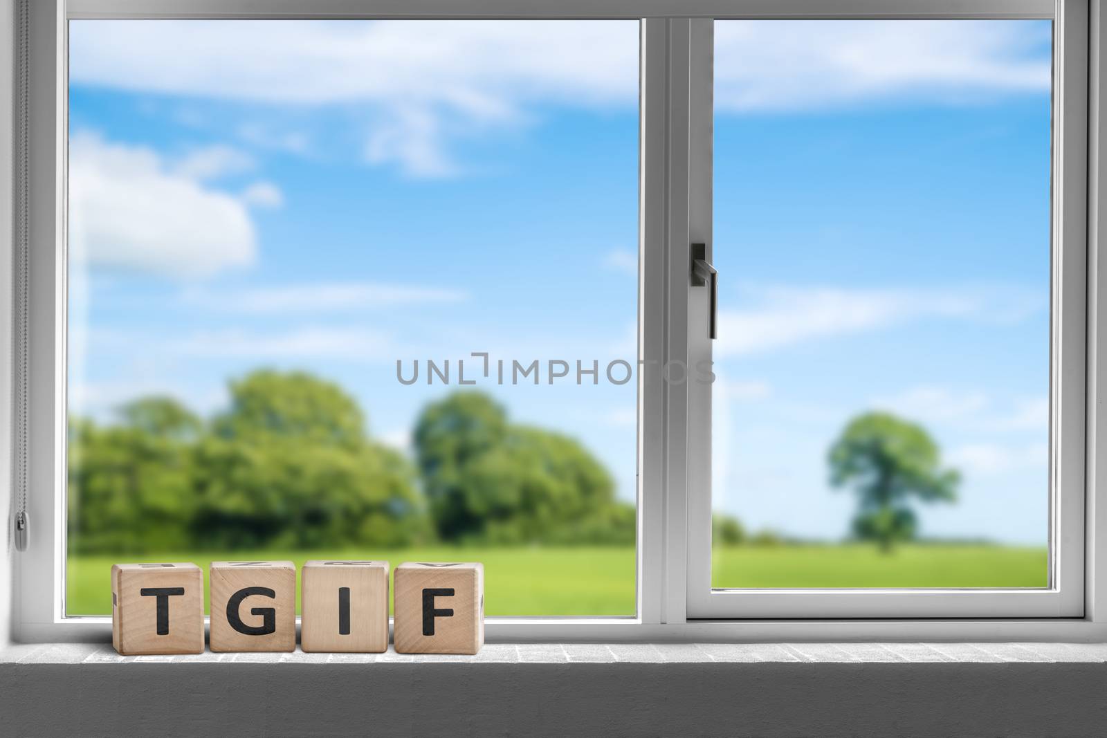 TGIF weekend sign in a white window by Sportactive